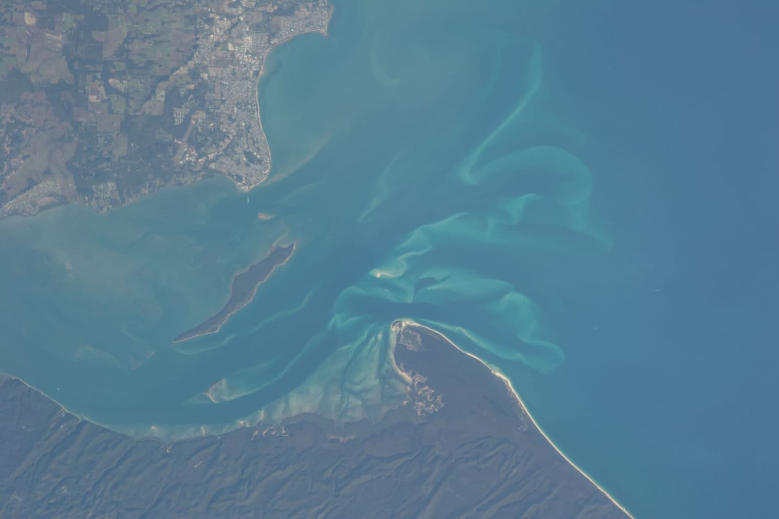 Astronaut photo of Hervey Bay and the northern tip of K'gari taken from the International Space Station