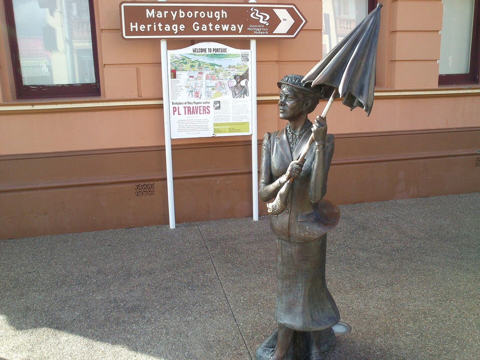 The bronze Mary Poppins statue with her umbrella on a Maryborough street