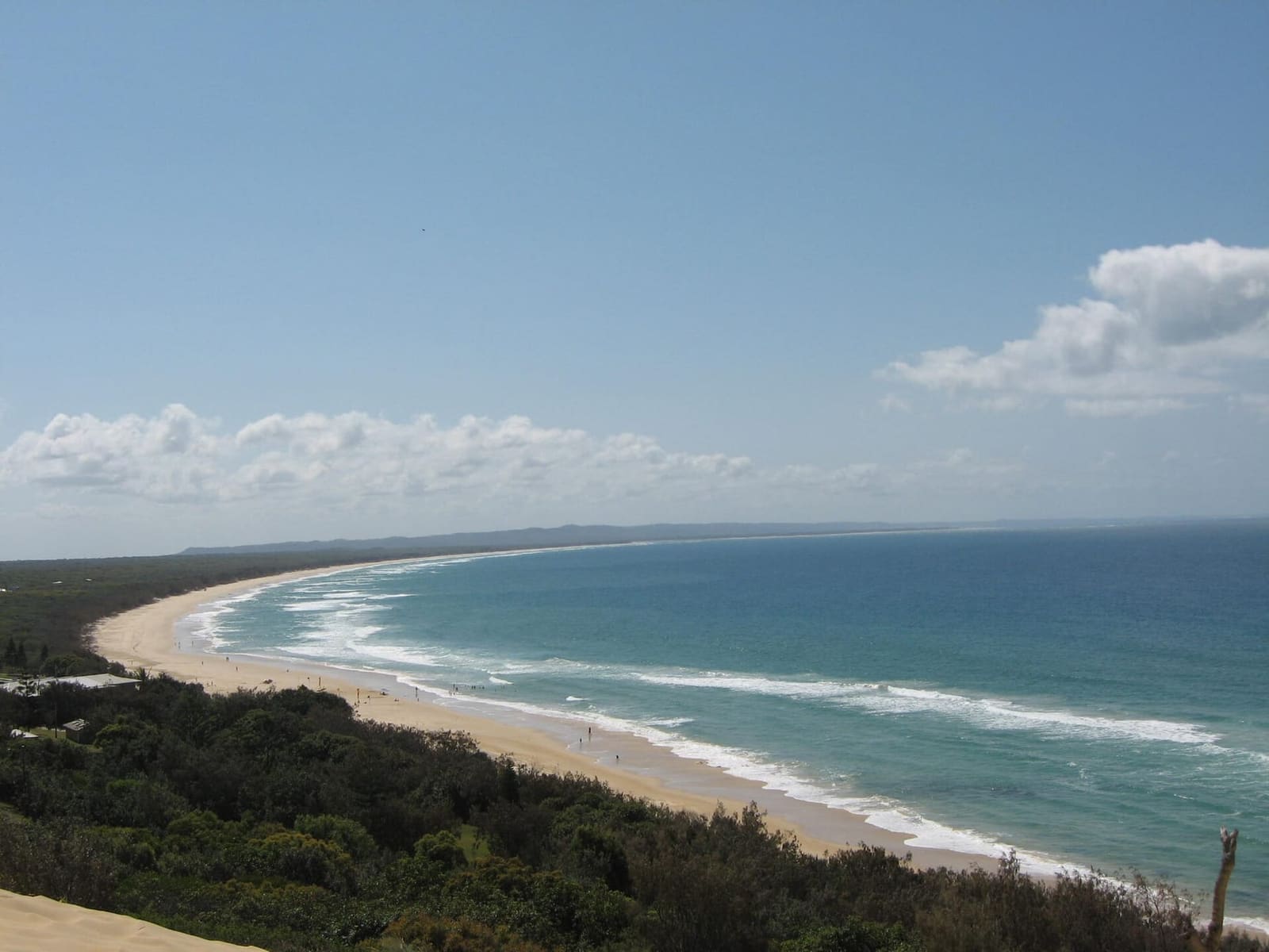 Rainbow Beach sweeping north toward K'gari, with surf and dunes